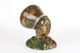 An African Verdite carved figure of a Zulu womansigned D. Molema, with traditional head-dress,