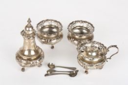 A Victorian four piece silver cruet sethallmarked London 1900 (2), 1902 and 1904, with squat bodies