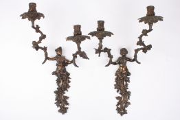 A large pair of early 20th century French brass two branch wall sconcesformed as cherubs holding