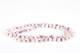 A flurospar bead necklace with bolt ring fastener, overall length 80cmCondition: Generally appear