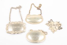 A Georgian silver Madeira decanter labeltogether with a Victorian Brandy label, and two silver