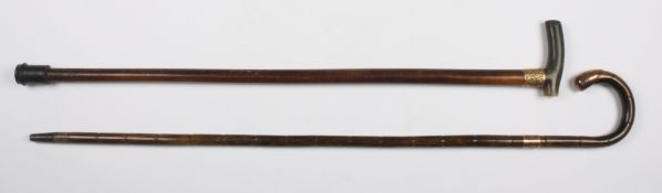 An early 20th century 9ct gold mounted partridge wood walking stickwith curved gold capped handle