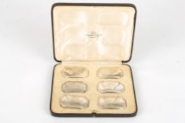 A matched set of six George VI silver decanter labels,hallmarked Sheffield 1937, Brandy,