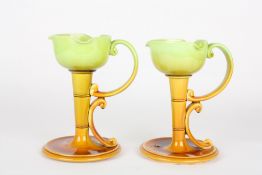 An unusual pair of Palissy pottery chamber stickswith graduated green to brown glaze, with lobed