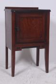 An Edwardian mahogany pot cupboard raise