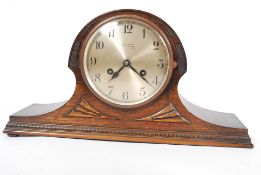 A 1900's oak cased napoleons hat mantel