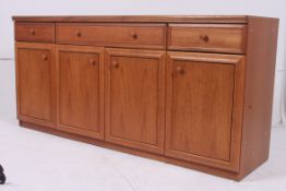A 1970's retro teak sideboard comprising