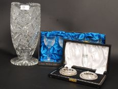 A large cut glass vase together with a c