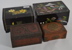 A collection of vintage boxes, two being