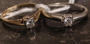 Two 9k gold single stone diamond rings.