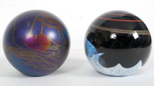 A glass paperweight by Caithness ' Meteo