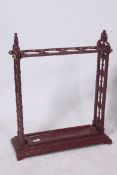A Victorian style cast iron ochre red pa