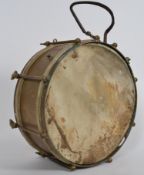 A vintage brass and hide handheld drum