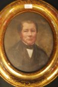 A 19th century oil on board oval portrai