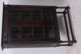 A 1930's oak barleytwist bookcase displa
