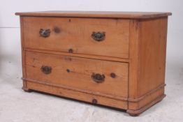 A 19th century stripped pine end of bed