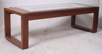 A 1970's teak and tile top retro coffee