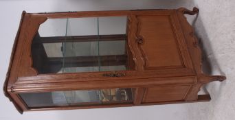 A 20th century Louis style oak vitrine d