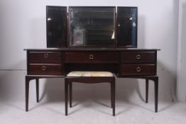 A Stag mahogany ' minstrel ' dressing ta