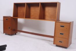 A 1970's teak retro headboard having sec