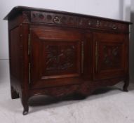 A 19th century carved oak buffet / sideb