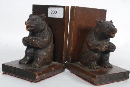 A pair of black forest wooden carved boo