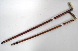 A pair of horn / Ivory handled silver co