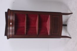 An Edwardian mahogany inlaid bow front u