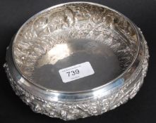 A sterling silver bowl decorated in reli