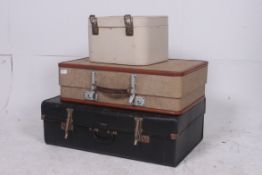 A stack of vintage suitcases to include