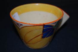 A Clarice Cliff handpainted cup in the F