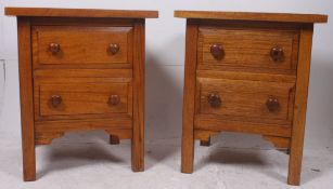 A large pair of oak bedside cabinets rai