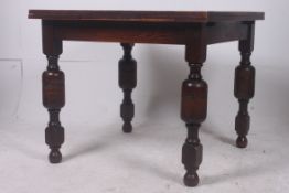 A 1930's oak draw leaf dining table rais