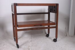 A vintage metamorphic two tier tea troll