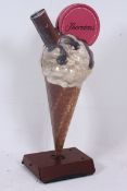 A large retro ice cream cone shop advert