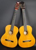 A pair of Hohner acoustic six string gu