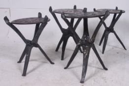 Four African mid century carved ebonised