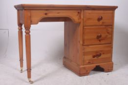 A modern good quality pine kneehole desk