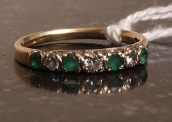 A 9k gold emerald and diamond ring. Weig