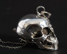 An early 20th century style white metal