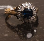 An 18k gold sapphire and diamond ring. W