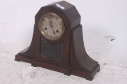A 1930's Art Deco oak case mantel clock