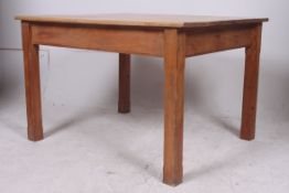 A large vintage pine kitchen dining tabl