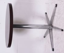 A retro rosewood coffee table raised on