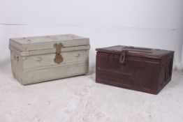 Two vintage metal trunks one being an am