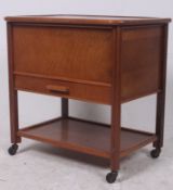 A vintage 1950's retro sewing box raised