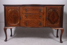 An Edwardian bow front sideboard dresser