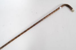 A silver hallmarked tipped walking cane