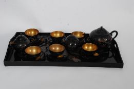 A Chinese laquered six setting tea servi