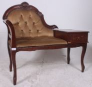 A 20th century rococo walnut telephone t